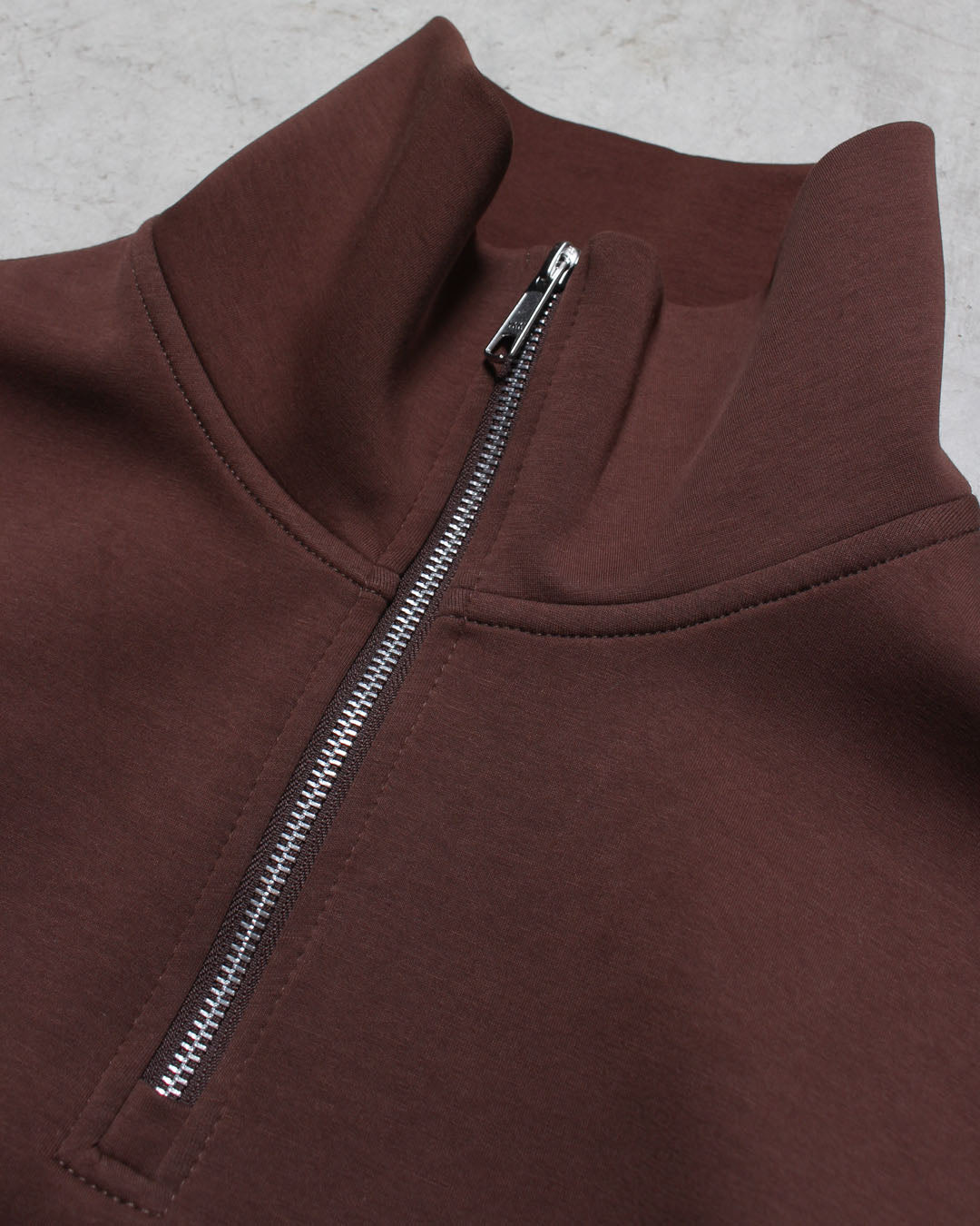 ハーフジップトップス